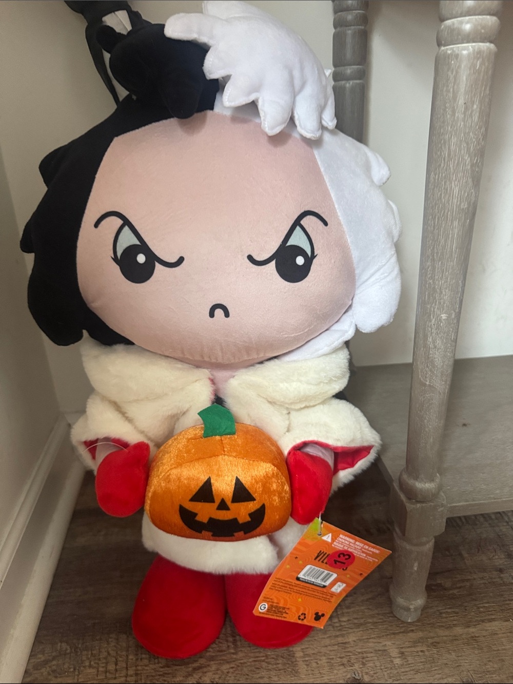 Cruella door greeter with pumpkin in hand- Disney